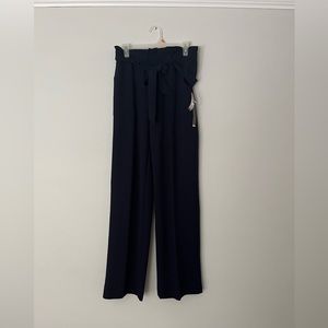 Never worn wide leg high rise navy pants.